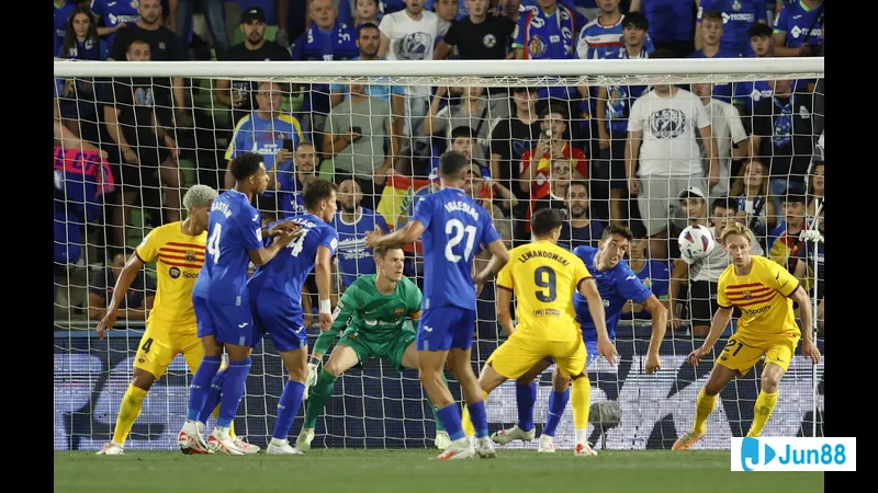 Barca and Getafe players fighting for the ball during a crucial moment in the match Barca and Getafe players fighting for the ball during a crucial moment in the match